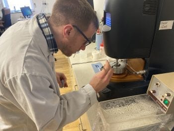 Our technical manager testing a sample on our rheometer.