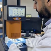 Wasif Altaf loading sample on the Core Rheometer