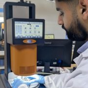 Wasif Altaf loading sample on the Core Rheometer